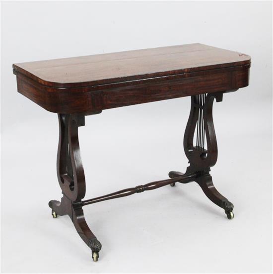 A Regency ebony strung mahogany tea table, W.3ft 3in. D.1ft 7in. H.2ft 6in.